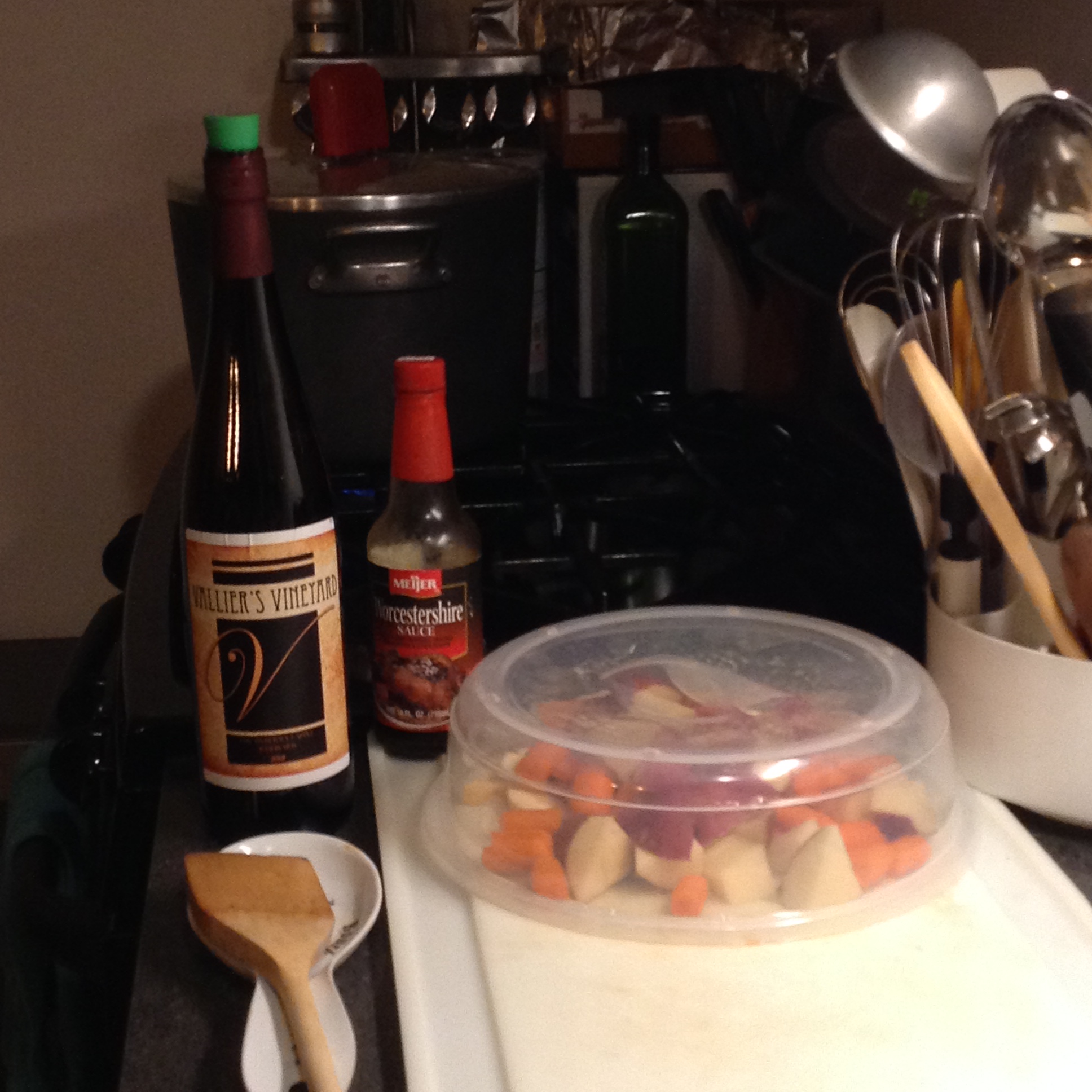 Photo of bottle of Tom Vallier's "Vallier's Vineyard" wine with vegetables on counter